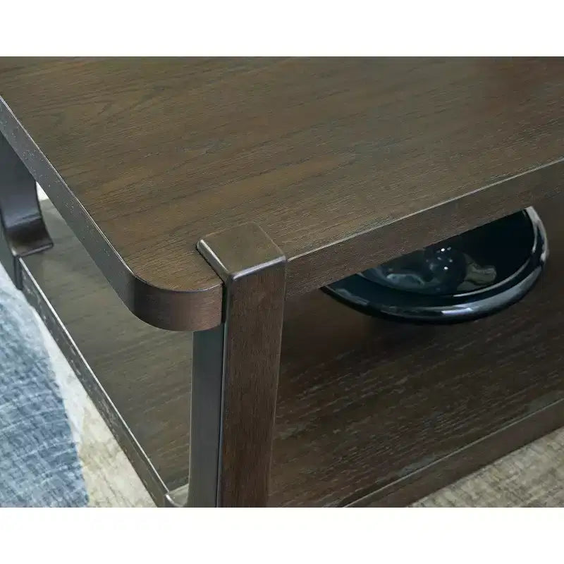Signature Design by Ashley Breckington Coffee Table - Dark Brown Wood Finish with Rolling Casters, Lower Shelf Storage