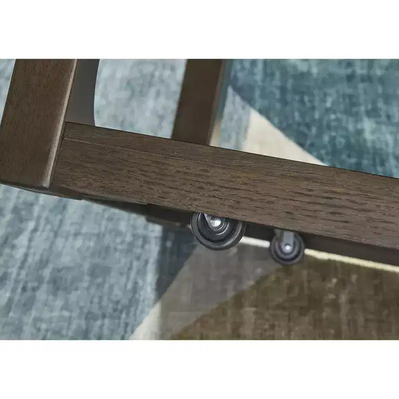 Signature Design by Ashley Breckington Coffee Table - Dark Brown Wood Finish with Rolling Casters, Lower Shelf Storage